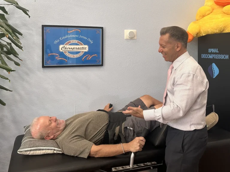 Chiropractor guiding patient during spinal decompression therapy at On Purpose Chiropractic