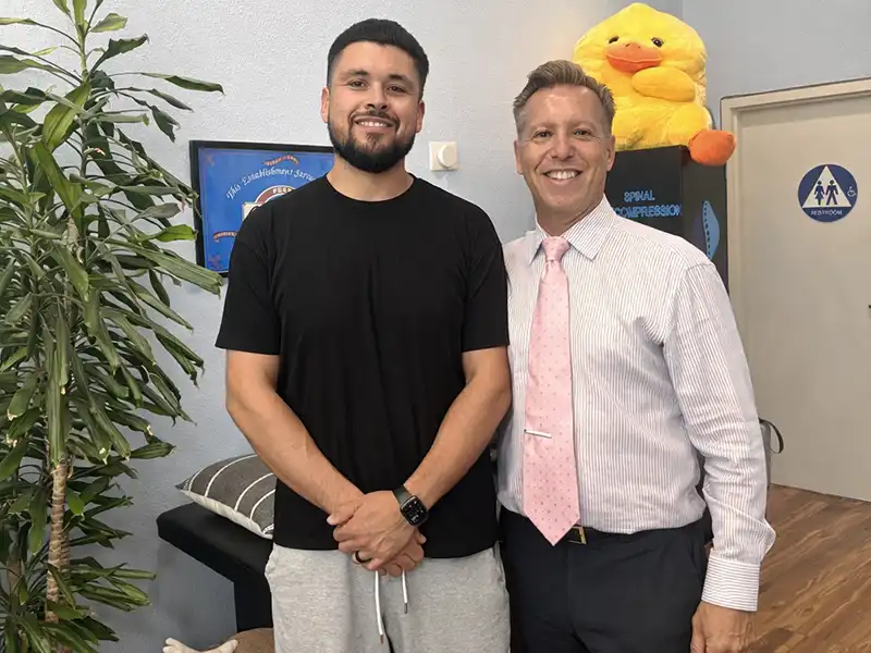 Chiropractor Dr. with Patient Smile on Purpose Chiropractic